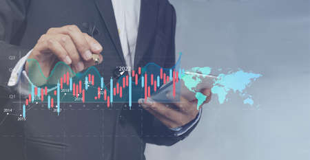 Businessman pointing out goals by highlighting the success of the business growth strategy in the...