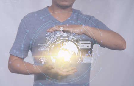 Businessman creates a virtual icon global internet connection metaverse internet connection application technology for global business and digital marketing Digital Link Technology Finance and Bankingの写真素材
