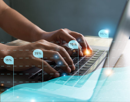 Businessmen use a laptop to view company financial reports and graphics showing financial growth data and figures financial management concepts, planning, strategy, analysis, growth, and profit.の写真素材
