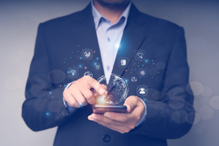 Businessman using smart mobile phone, global internet connection technology business and digital marketing, finance and banking, digital link technology, big data.の写真素材