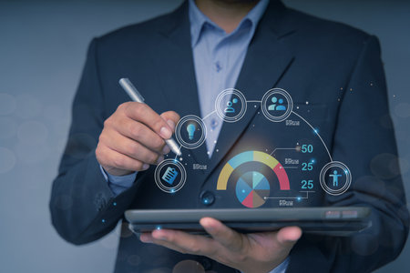 Businessman using tablet to navigate user interface UX UI futuristic graphic icon design with people outline communication and planning innovation concept teamwork strategic planning modern technologyの写真素材