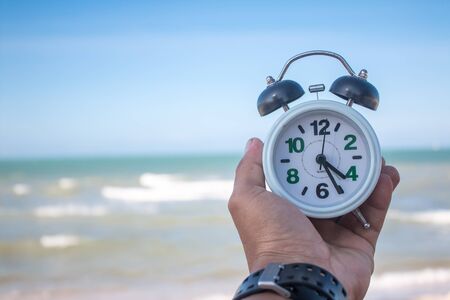 Clock on the sandの写真素材