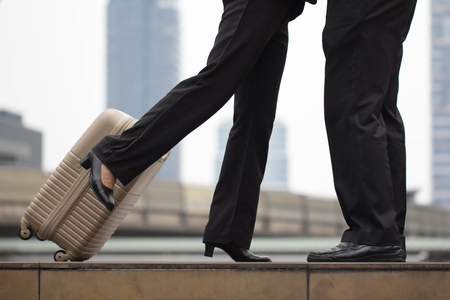 close-up a couple hug and kiss with baggageの写真素材