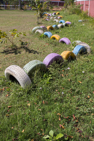 Wall of Stacks old used car tyres の写真素材
