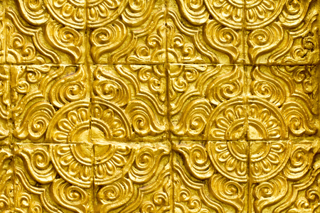 Golden colour cement stucco abstract wall texture background. Thailand traditional vintage ancient beautiful pattern style temple.
Color gold brush painted plaster grain rusty scratch solid surface structure wallpaper.の写真素材
