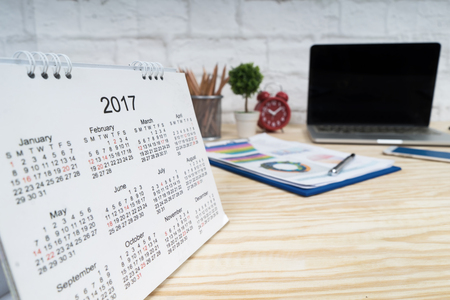 2017 Calendar on wooden table, working place with copy space.の写真素材