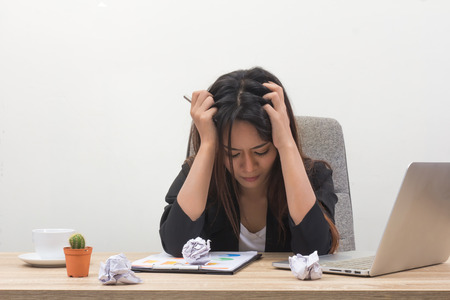 Woman feeling stress from work.
Young and beautiful businesswoman with laptop computer tired in office.
Exhausted female worker having a headache.
Nervous lady pulling her hair out.の写真素材