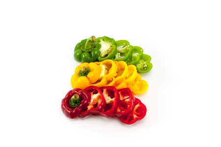 Slicing Sweet peppers on white backgroundの写真素材