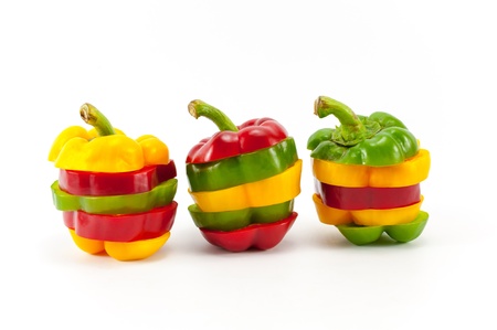 Mixing Colors of Slicing Sweet Peppers on White Backgroundの写真素材
