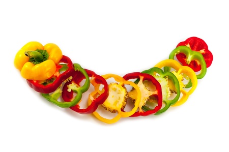 Mixing Colors of Slicing Sweet Peppers on White Backgroundの写真素材