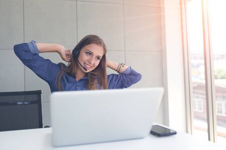 Young woman twisted relieve fatigue from work.