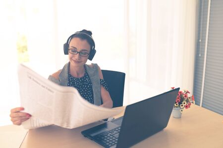 Smiling female using technology, financial business lifestyle. Beautiful professional woman working...