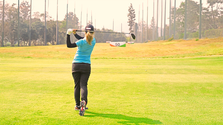 Pro Golf long putting golf ball in to the hole, sunset scene timeの写真素材