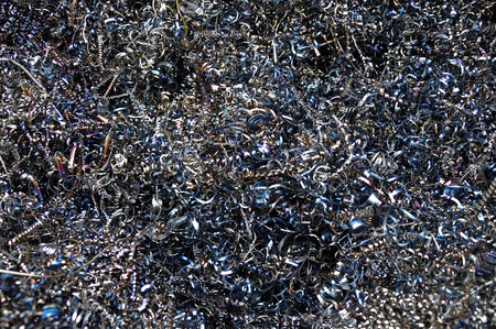 Background texture of metal filings and waste produced during the manufacturing process in an engineering workshopの写真素材