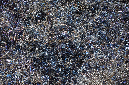 Background texture of metal filings and waste produced during the manufacturing process in an engineering workshopの写真素材