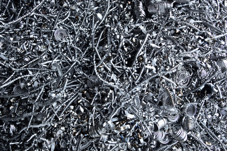 Background texture of metal filings and waste produced during the manufacturing process in an engineering workshopの写真素材