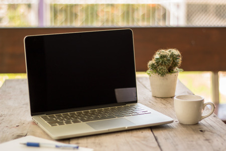business work on laptop and tea time or coffee timeの写真素材