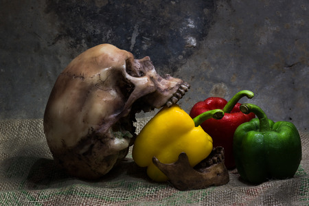 sweet pepper and skull is still lifeの写真素材