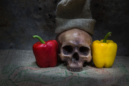 sweet pepper and skull is still lifeの写真素材