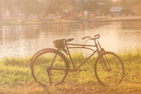 classic bicycle near the waterway in the public park for cxercise on fair-weatherの写真素材