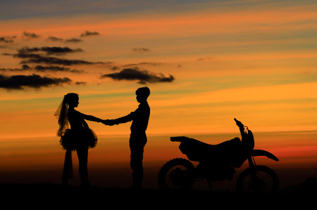 Sweetheart shadow and colorful background before sunset / silhouette pictureの写真素材
