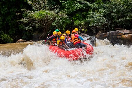 Phitsanulok Province, Thailand - August 2019 The many tourists in raft adventure on khek river is power full water in rainy season, they are enjoy and funny in caseのeditorial素材