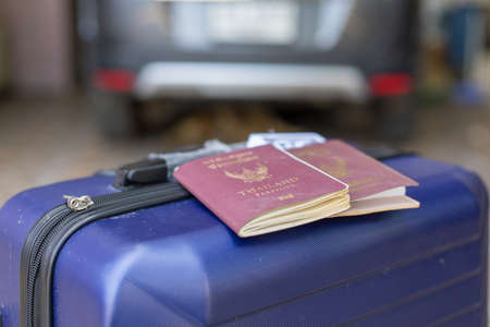 Thai passport and traveling bag is already for travel with pocket moneyの写真素材