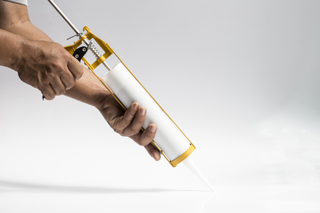 Gun with silicon white backgroundの写真素材