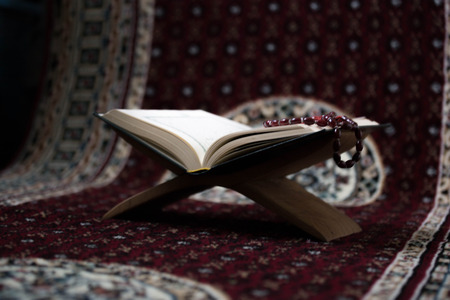 Quran - holy book of Muslims around the world put on wooden boardsの写真素材