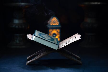 Quran - Muslim holy book placed on a wooden boardの写真素材