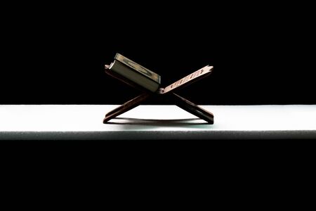 Quran - Muslim holy book placed on a wooden boardの写真素材