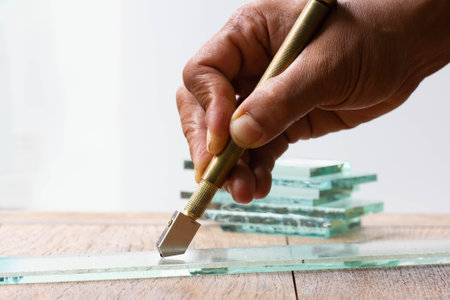 Technicians are using cutting tools, cut glass according to customer sizeの写真素材