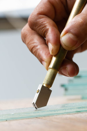 Technicians are using cutting tools, cut glass according to customer sizeの写真素材