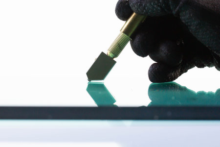 Technicians are using cutting tools, cut glass according to customer sizeの写真素材