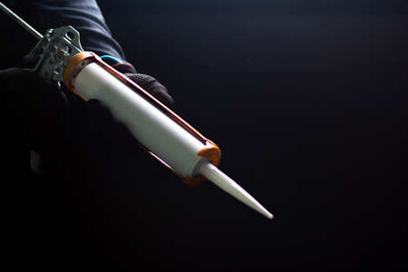 Craftsmen are using silicone adhesives for general and industrial applications. premium acetoxy silicone sealantの写真素材