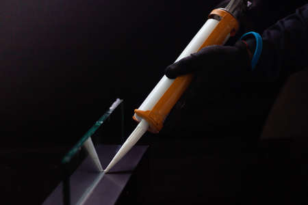 Craftsmen are using silicone adhesives for general and industrial applications. premium acetoxy silicone sealantの写真素材