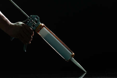 Craftsmen are using silicone adhesives for general and industrial applications. premium acetoxy silicone sealantの写真素材