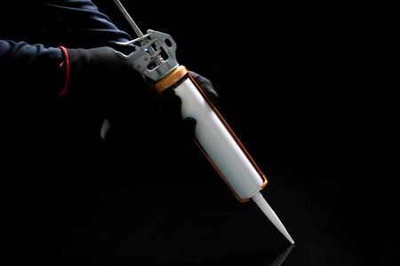 Craftsmen are using silicone adhesives for general and industrial applications. premium acetoxy silicone sealantの写真素材