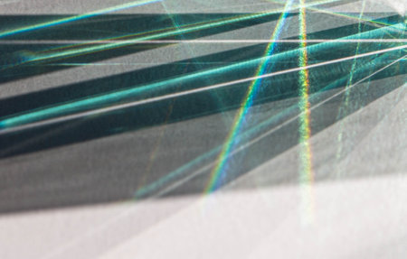 abstract background: light rays on a piece of paper with shadowの写真素材