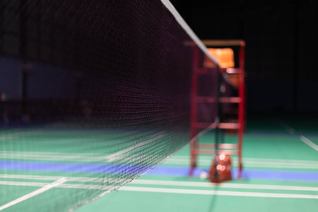badminton court with net and ball, closeup of photoの写真素材