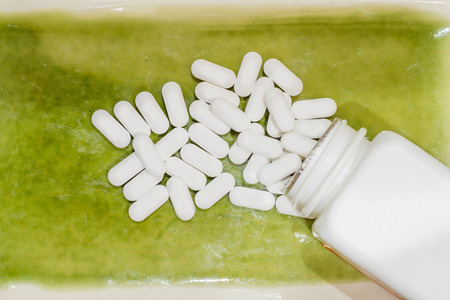 Drugs and white bottle.