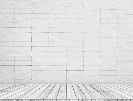 Backdrop sandstone brick wall and wood slabs arranged in perspective texture background.の写真素材