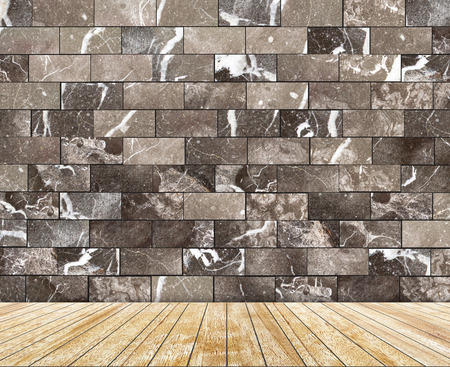Backdrop  marble brick wall and wood slabs arranged in perspective texture background.の写真素材
