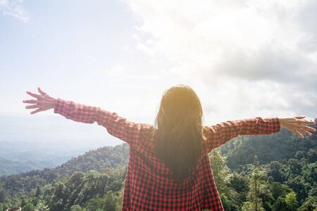Happy woman Enjoying Nature on top of mountain. Freedom concept. Outdoor.の写真素材