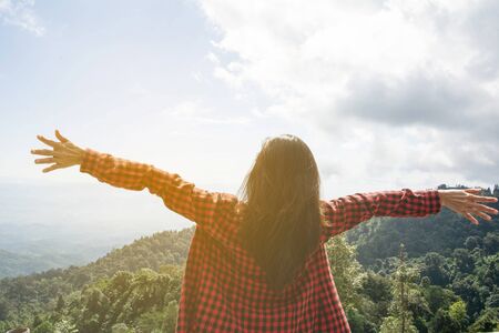 Happy woman Enjoying Nature on top of mountain. Freedom concept. Outdoor.の写真素材