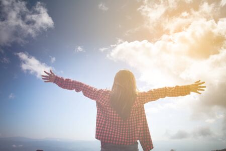 Happy woman Enjoying Nature on top of mountain. Freedom concept. Outdoor.の写真素材