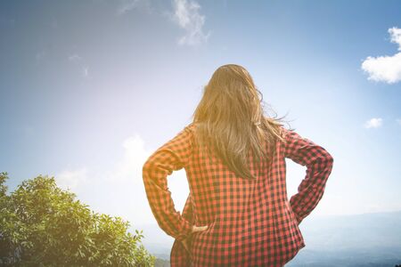 Happy woman Enjoying Nature on top of mountain. Freedom concept. Outdoor.の写真素材