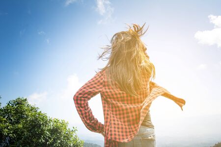 Happy woman Enjoying Nature on top of mountain. Freedom concept. Outdoor.の写真素材