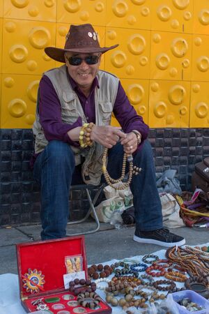 Suifenhe, China 06.16.2017: Chinese cowboy, seller in the flea marketのeditorial素材