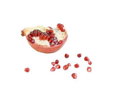 A slice of ripe pomegranate and pomegranate grain, isolate, close-upの写真素材